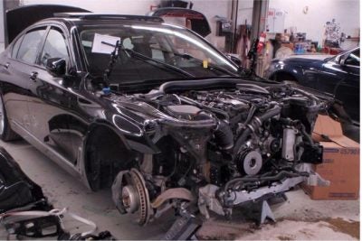 A black BMW about to be repaired at Allentown Collision.